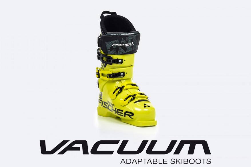 Gelbe Skischuhe von Fischer mit Vacuumtechnik und mehreren Schnallen für optimalen Halt und Komfort.